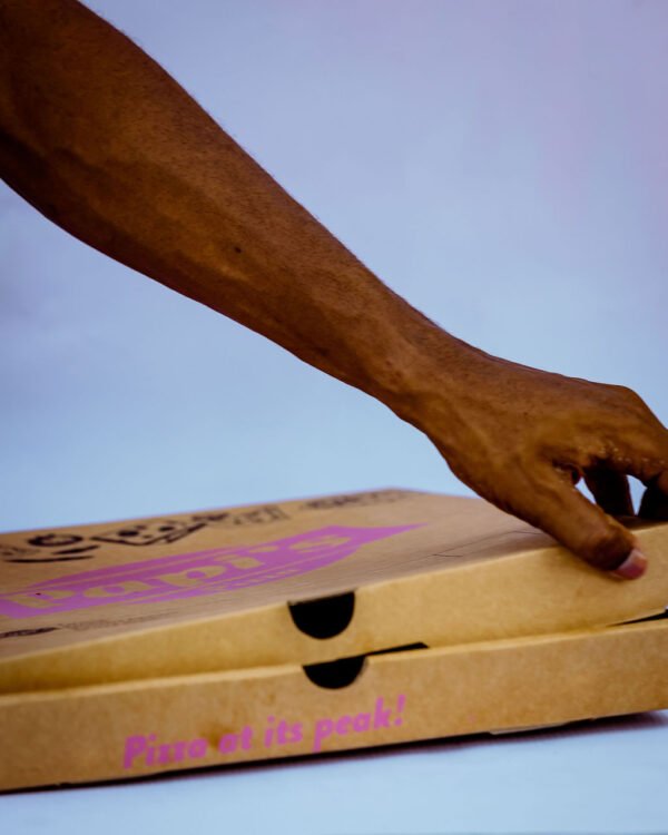 Aquada Box Branded Kraft Pizza Box held with one hand