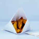 Aquada Box Snack Bag White filled with snacks and empty bags on the right